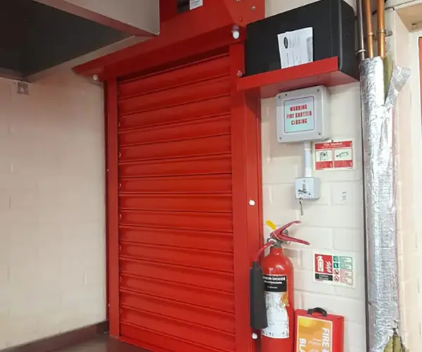 Fire rated roller shutter installation in a commercial building for enhanced fire safety and protection